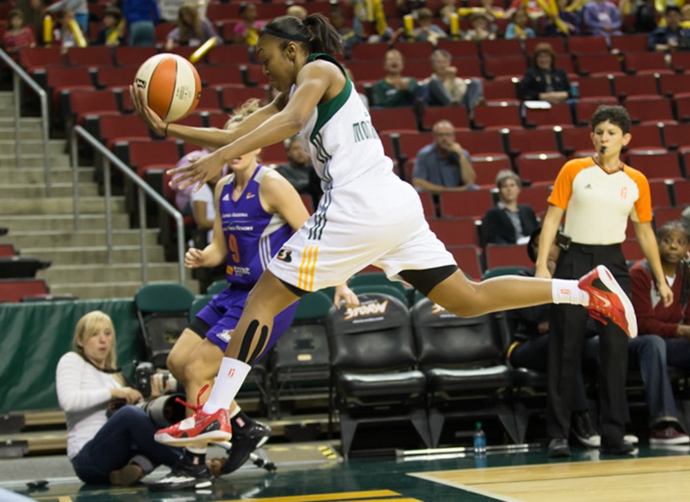 Renee Montgomery flies through the air as she attempts to save a ball headed out-of-bounds. (Neil Enns/Storm Photos)