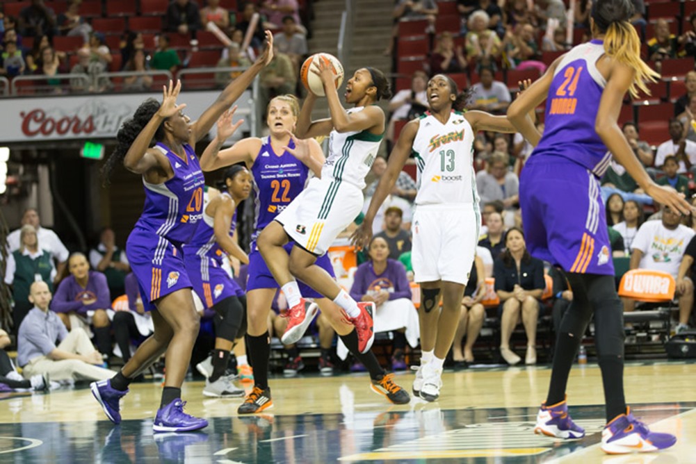 Renee Montgomery levitates through the Mercury defense. (Neil Enns/Storm Photos)